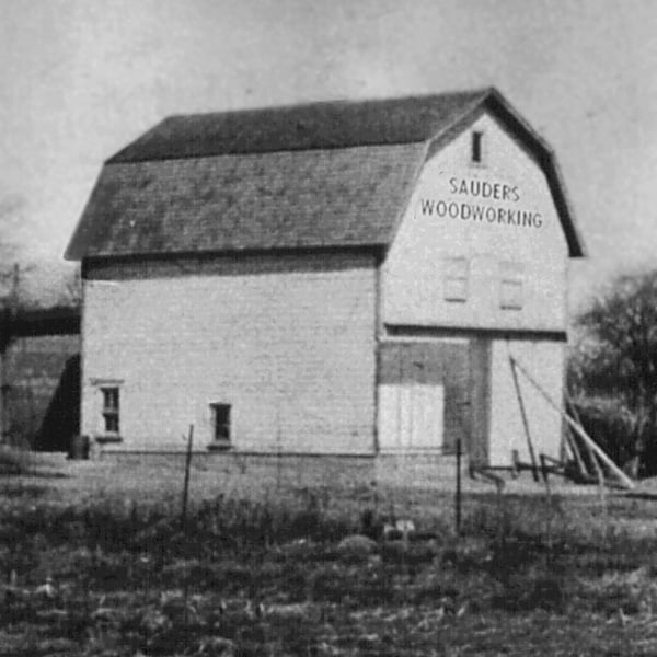 Black and White image of old large barn which was the original Sauder Manufacturing Co. Workshop