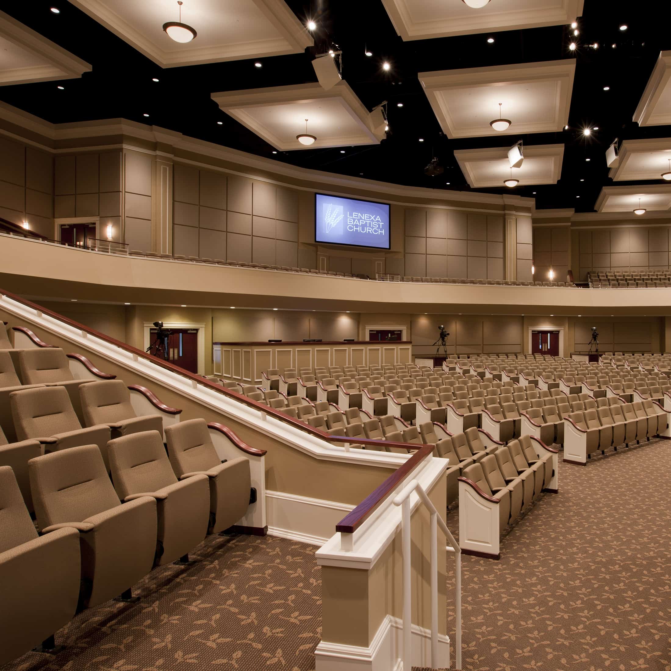 Interior of Lenexa Baptist Church showing Clarity Auditorium Seating with Colonial Pew Ends.