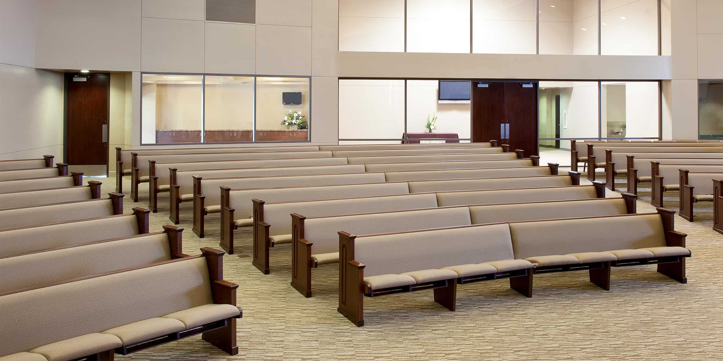 Mitered Pews with Arm Rest Pew Ends, Underseat Bookracks and, Individual Definity Seats made by Sauder Worship Seating