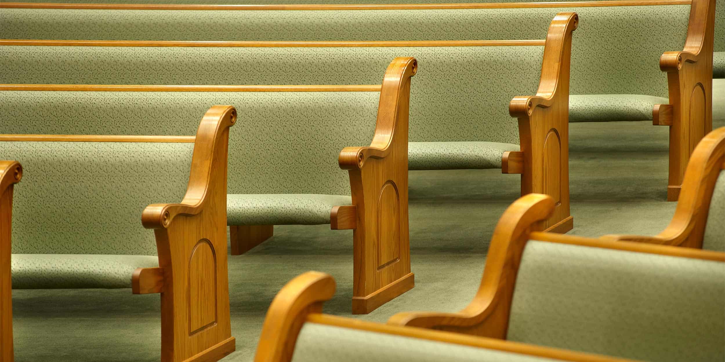Close up of fully upholstered Sauder pews in First Baptist Church located in Marion, Illinois