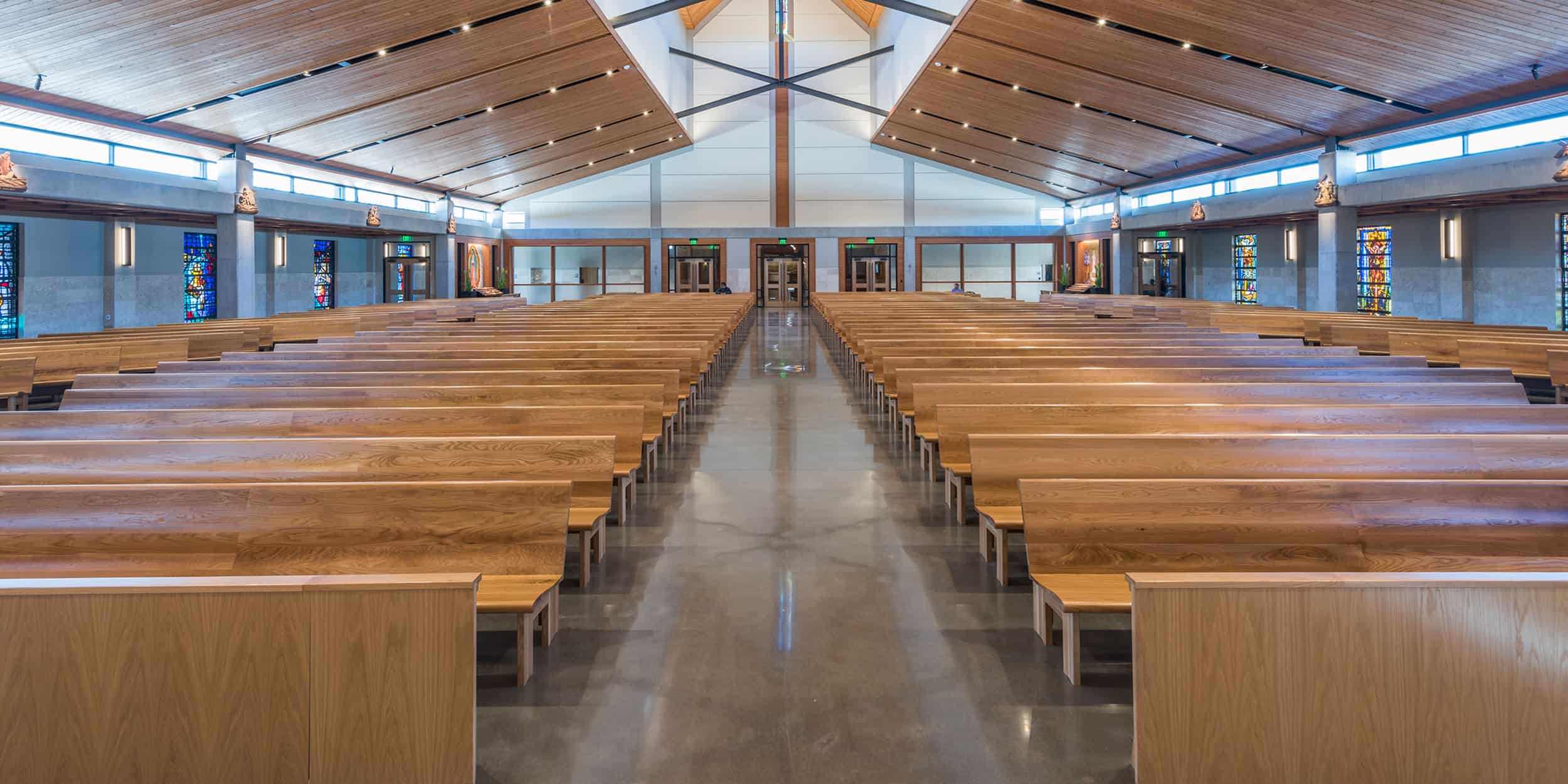 Interior of Good Shepherd Church showing all wood straight pews from Sauder Worship Seating.