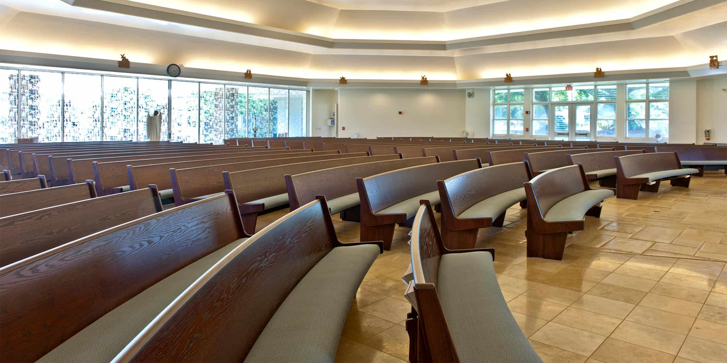 Curved Pews with upholstered seat and wood back