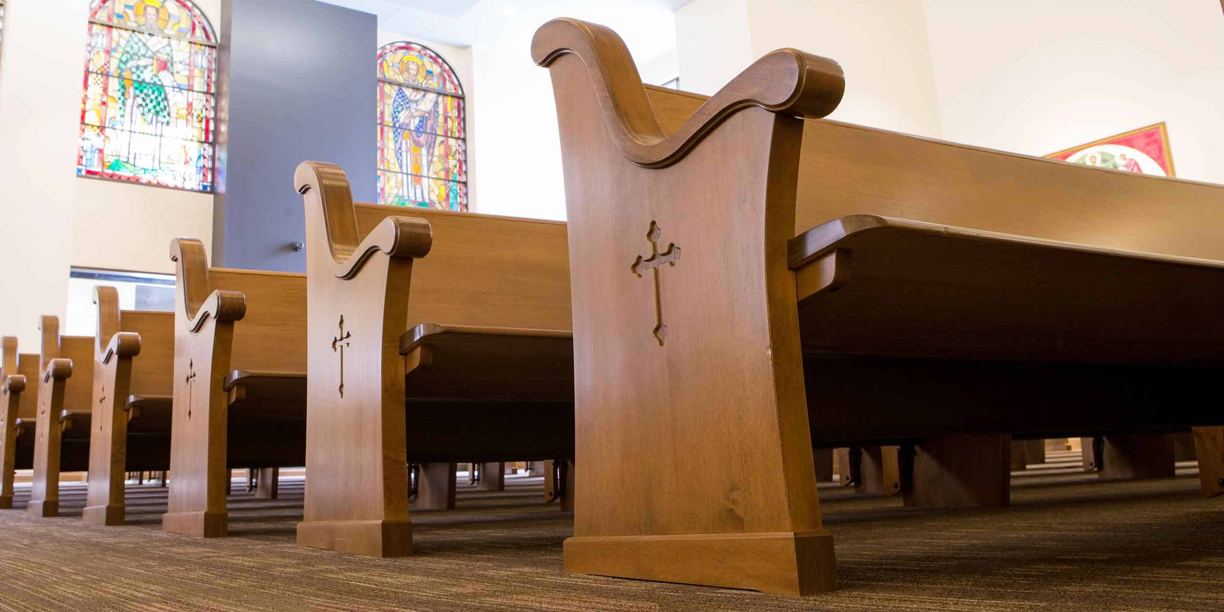 Close up of pew ends on church pews made by Sauder Worship Seating