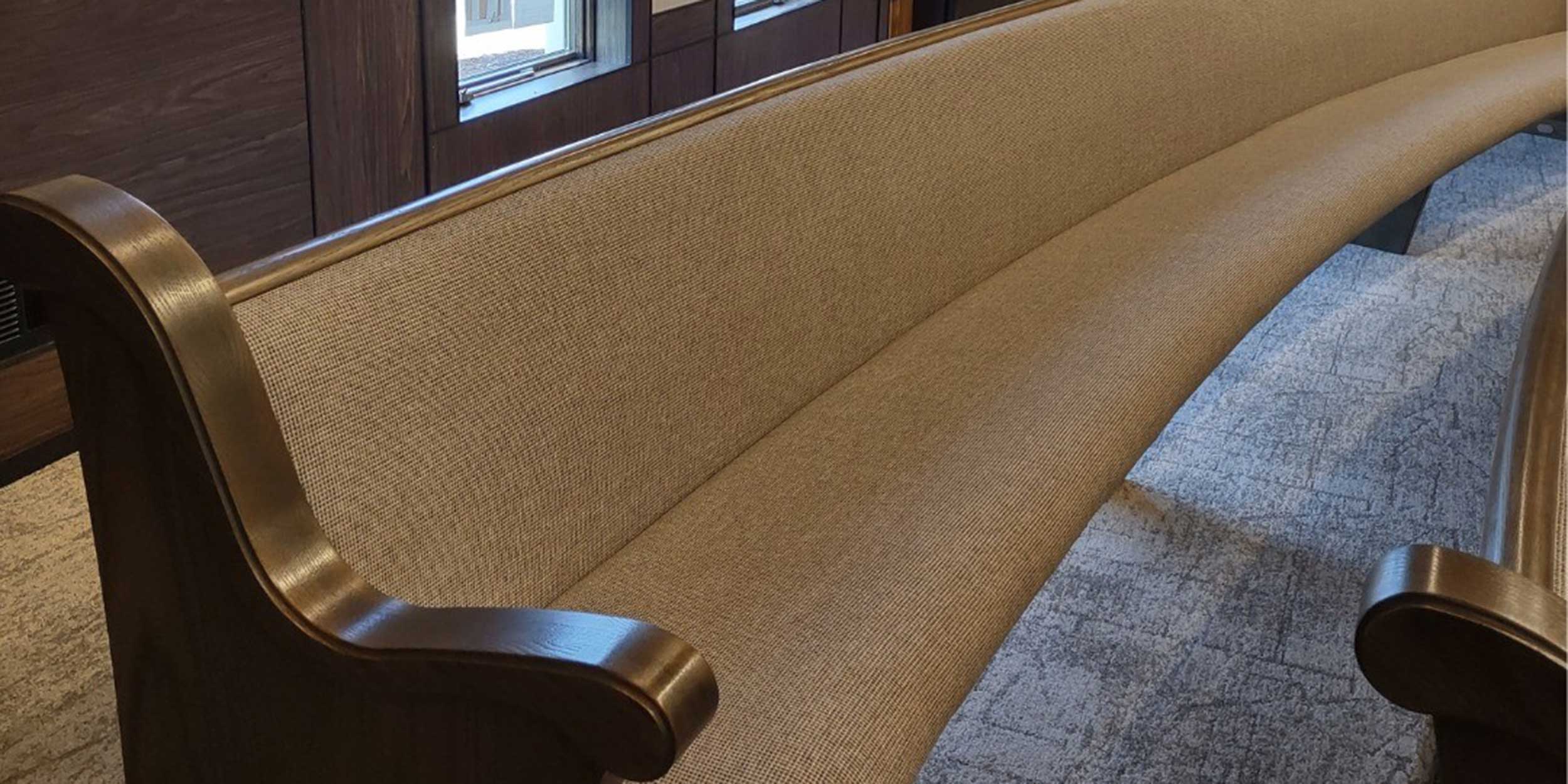 Fully upholstered curved radial pew from Sauder Worship Seating