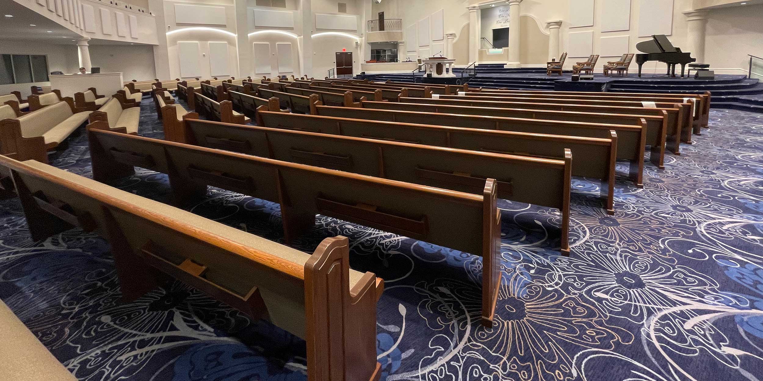 Fully upholstered wood pews with upholstered back of back